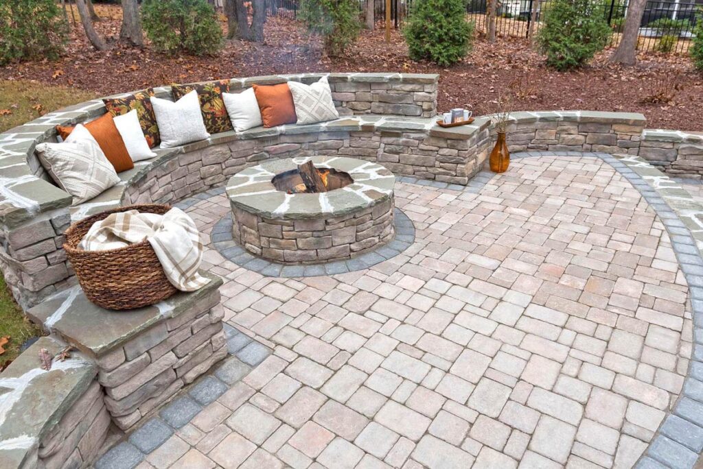 paver patio installed by Bellus Terra with seating bench and fire pit