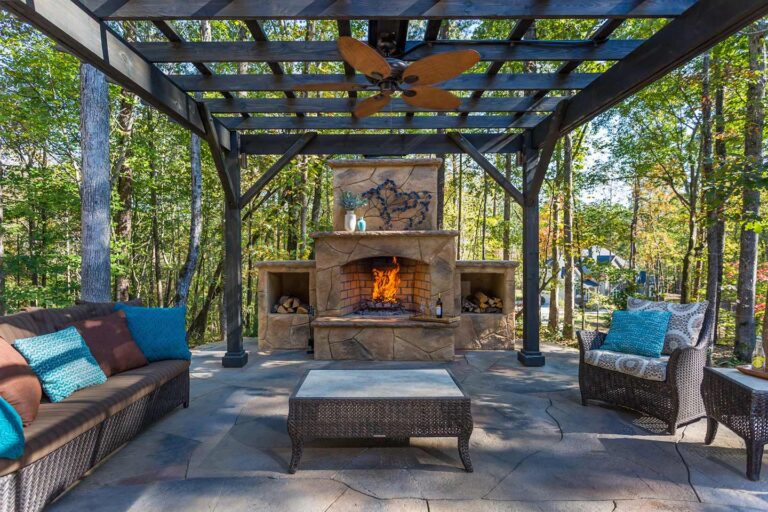 outdoor fireplace installed with pergola in wake forest by Bellus Terra