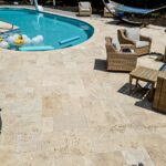 Custom Stone Pool Deck installed in Raleigh backyard by Bellus Terra